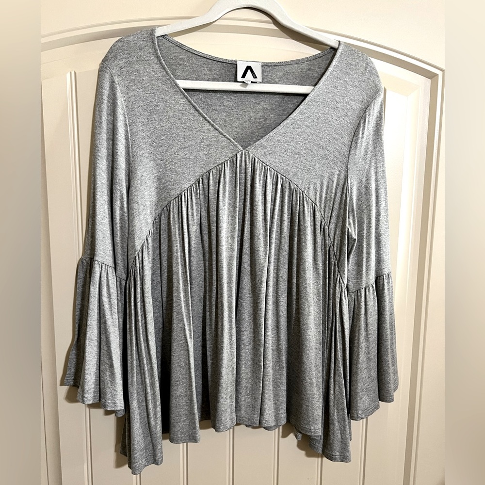 COA ruffled sleeve top with beautiful flow and super soft!